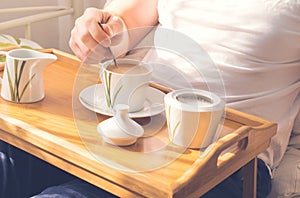 Cup of coffee in bed.