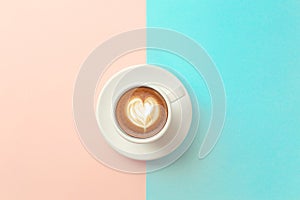 Cup of coffee on blue and orange background