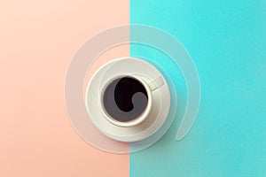 Cup of coffee on blue and orange background