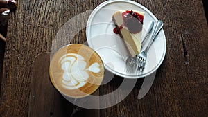 A cup of Coffee and blueberry cake