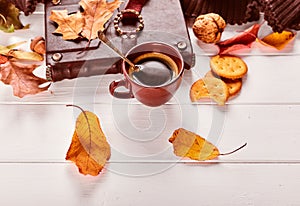 Cup coffee with book in leather binding