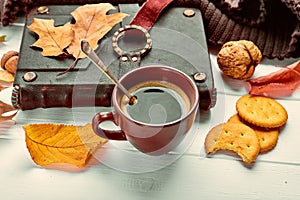 Cup coffee with book in leather binding