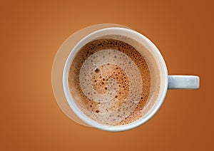 Cup of coffee on brown color background