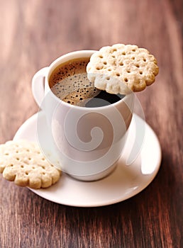 Cup of coffee and butter biscuits.