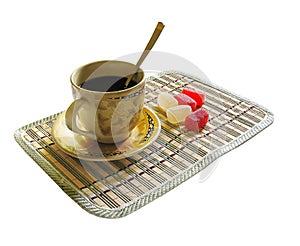 Cup of coffee and candy on a white background