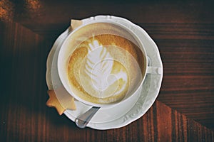 Cup of coffee with cappuccino art