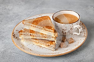 Cup of coffee and cheese toasted sandwich