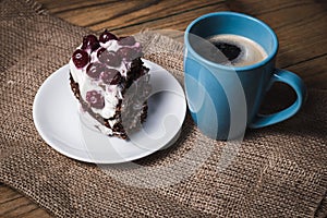 Cup of coffee and cherry cake
