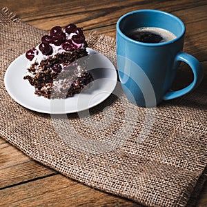 Cup of coffee and cherry cake