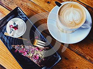 Cup of Coffee and chocolate cake. Latte art