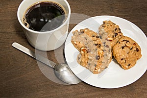 Cup of coffee and chocolate cookies