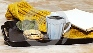 Cup of coffee, chocolate cookies in tray during the morning
