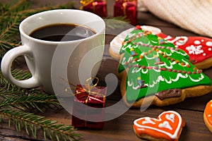 Cup of coffee in Christmas , gingerbread and christmas decorati