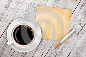 Cup of coffee with cigarette