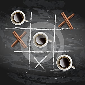 Cup of coffee, cinnamon sticks in the composition and form of tic-tac-toe game on black chalkboard background. Tic Tac photo