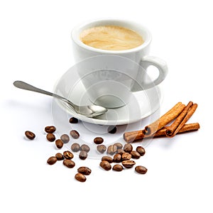 Cup of coffee and cinnamon on white background