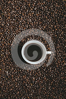 Cup of coffee with cofee beans