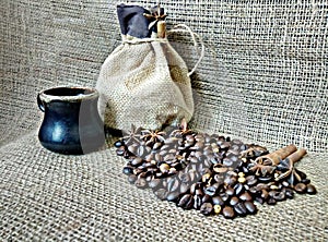 A cup of coffee with coffee beans