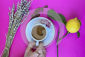 A cup of coffee with coffee beans