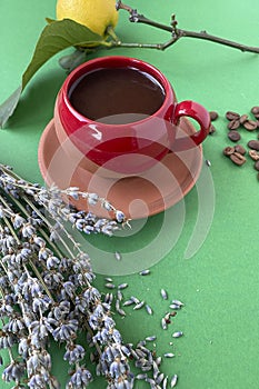 A cup of coffee with coffee beans