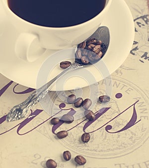 Cup of coffee and coffee beans.