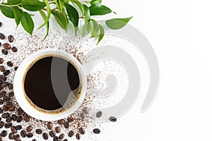 Cup of coffee, coffee beans and green leaves on white background, flat lay