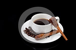 Cup of coffee and coffee beans with Sugar Stick Cinnamon