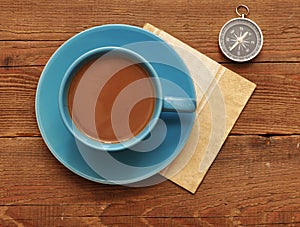 Cup of coffee and compass