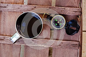 Cup of coffee with compass