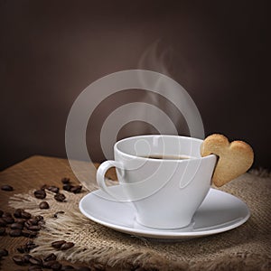 Cup of coffee with cookie
