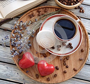 Cup of coffee with cookies in bed