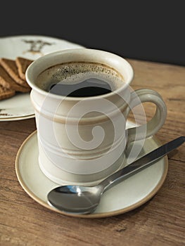 Cup of coffee and cookies on the table