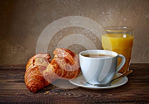 Cup of coffee, croissants and orange juice