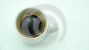 Cup of coffee top view white background.
