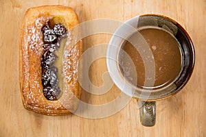 Cup of coffee and danish pastry.