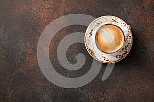 Cup of coffee on dark table