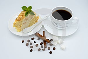 A cup of coffee and a delicious cake photo