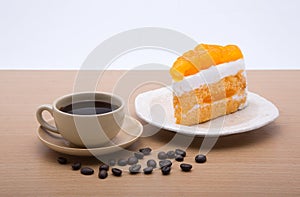 Cup of coffee and delicious cake on white background