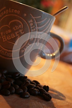 A cup of coffee displayed with beans