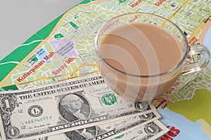 Cup of coffee and dollars on turkish map, planning travel