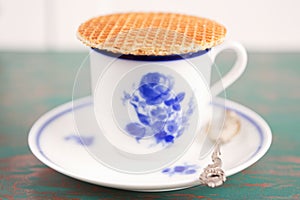 Cup of coffee with a Dutch stroopwafel cookie