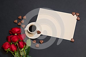 Cup of coffee, empty card for your text, heart shape chocolate candies and red roses