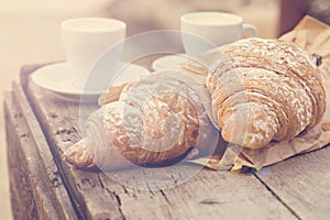 Cup of coffee espresso and croissant