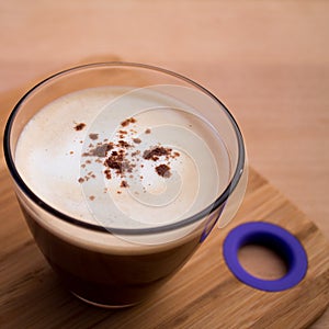 Cup of coffee with foam cinnamon sprinkled