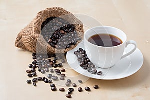 Cup of coffee and fresh roasted organic Coffee beans