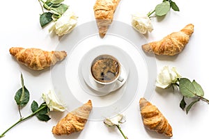 Cup of coffee and freshly baked croissants. Top view. Flat lay. Concept french breakfast