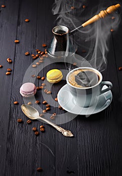 Cup coffee with grain and cezve