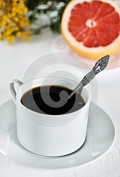 Cup of coffee and grapefruit