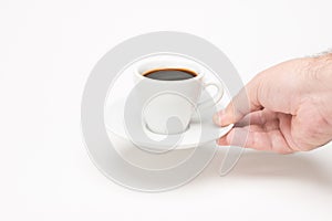 Cup of coffee with hand