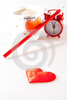 Cup of coffee, heart, pencil and clock isolated on white background